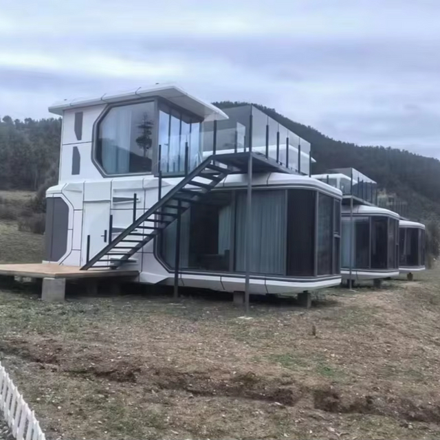 Sistema domestico di lusso per capsule spaziali a due piani, hotel mobili sulla spiaggia e case container per l'alloggio in famiglia per supermercati ed edifici per uffici